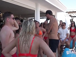 Babes get wild in a pool at an outdoor party